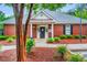 Charming clubhouse with well-maintained landscaping, brick facade, and inviting entrance at 203 Witheridge Ct, Apex, NC 27502