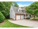 Beautiful home showcasing a spacious driveway and an attached two-car garage at 203 Witheridge Ct, Apex, NC 27502