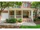 Inviting front porch with white railing, offering a perfect spot to relax at 203 Witheridge Ct, Apex, NC 27502