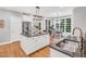 Open kitchen with a large island, stainless steel appliances, and eat-in breakfast nook at 203 Witheridge Ct, Apex, NC 27502