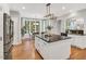 Bright and airy kitchen with stainless steel appliances, central island, and eat in dining area at 203 Witheridge Ct, Apex, NC 27502