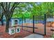 Community playground with a library in front of the enclosed fenced area, with playground signs at 203 Witheridge Ct, Apex, NC 27502