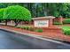 Community entrance featuring the 'Abbington' sign surrounded by brickwork and manicured landscaping at 203 Witheridge Ct, Apex, NC 27502