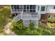 Aerial view of backyard with deck and landscaped patio, complemented by lush green lawns at 204 Muirfield Ln, Clayton, NC 27527