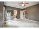 Neutral bedroom featuring carpet and an open door to a bathroom and closet space at 204 Muirfield Ln, Clayton, NC 27527