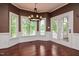 Sun-filled breakfast nook featuring a modern chandelier, lots of windows and access to the deck at 204 Muirfield Ln, Clayton, NC 27527