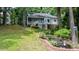 Lovely backyard with beautiful landscaping and raised brick flower bed at 204 Muirfield Ln, Clayton, NC 27527