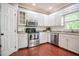 Well-lit kitchen features stainless steel appliances, granite countertops, and white cabinetry at 204 Muirfield Ln, Clayton, NC 27527
