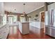 Modern kitchen featuring stainless steel appliances, granite countertops, and a central island at 204 Muirfield Ln, Clayton, NC 27527