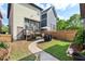 Spacious backyard with stone walkway, patio dining, and a well-maintained lawn at 2070 Great Ridge Pkwy, Chapel Hill, NC 27516