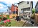 Charming backyard area with brick patio, screened porch, and lush rose bushes at 2070 Great Ridge Pkwy, Chapel Hill, NC 27516