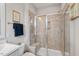 Contemporary bathroom with a tiled walk-in shower and white vanity at 2070 Great Ridge Pkwy, Chapel Hill, NC 27516