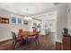 Well-lit dining area featuring hardwood floors and seamless connection to the modern kitchen and living room at 2070 Great Ridge Pkwy, Chapel Hill, NC 27516