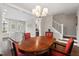 Charming dining area featuring hardwood floors and a view of the modern kitchen, perfect for Gathering meals at 2070 Great Ridge Pkwy, Chapel Hill, NC 27516