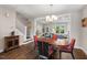 Elegant dining area with hardwood floors and open access to the living room and staircase, perfect for entertaining at 2070 Great Ridge Pkwy, Chapel Hill, NC 27516