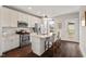 Bright kitchen with white cabinets, stainless steel appliances, and granite countertops at 2070 Great Ridge Pkwy, Chapel Hill, NC 27516