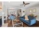 Comfortable living room with hardwood floors, a fireplace, and an open layout to the dining area and staircase at 2070 Great Ridge Pkwy, Chapel Hill, NC 27516