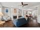 Bright living room with fireplace, hardwood floors, and an open layout to the dining area and kitchen at 2070 Great Ridge Pkwy, Chapel Hill, NC 27516