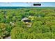 Stunning aerial view of a home nestled amongst mature trees and within close proximity to downtown Cary at 2109 W Marilyn Cir, Cary, NC 27513