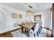 Dining room with modern light fixture and seating for six at 2109 W Marilyn Cir, Cary, NC 27513