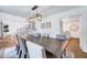 Elegant dining area with modern lighting fixture and seating for six at 2109 W Marilyn Cir, Cary, NC 27513