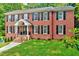Charming brick home features a manicured lawn and classic curb appeal at 2109 W Marilyn Cir, Cary, NC 27513