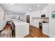 Open-concept kitchen featuring a large quartz island, sleek appliances, and ample cabinet space at 2109 W Marilyn Cir, Cary, NC 27513
