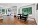 Bright living area featuring hardwood floors and a view of the lush backyard at 2109 W Marilyn Cir, Cary, NC 27513