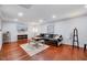 Cozy living room has recessed lights, hardwood floor, plush sofa and cute decor at 2109 W Marilyn Cir, Cary, NC 27513