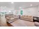 Open living room with abundant natural light and hardwood floors at 2109 W Marilyn Cir, Cary, NC 27513