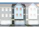Charming townhome facade with a clean modern design and attached garage, showcasing a welcoming curb appeal at 2135 Grouse Ski Cir, Apex, NC 27523