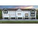 Row of charming two-story townhomes with black garage doors and a well-maintained lawn at 2152 Grouse Ski Cir, Apex, NC 27523