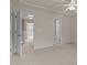 The primary bedroom features new carpet, neutral paint, and a ceiling fan, as well as an ensuite bathroom at 220 Mount Evans Dr, Durham, NC 27705