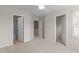 Neutral bedroom with carpet, ceiling fan and doorways to the bathroom and walk-in closet at 220 Mount Evans Dr, Durham, NC 27705
