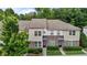 Beautiful townhomes featuring unique brick facade, trimmed bushes, and a well-manicured lawn at 220 Mount Evans Dr, Durham, NC 27705
