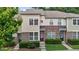 Attractive townhouse with brick accents, landscaped front yard, and colorful doors at 220 Mount Evans Dr, Durham, NC 27705