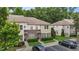 Charming exterior view of townhomes with brick accents, inviting entrances, and manicured landscaping at 220 Mount Evans Dr, Durham, NC 27705