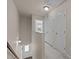 Upstairs hallway features fresh carpet, neutral paint, a view to downstairs, two large closets, and a ceiling access panel at 220 Mount Evans Dr, Durham, NC 27705