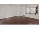 A spacious living room features hardwood floors, neutral paint, and an open floorplan to the kitchen at 220 Mount Evans Dr, Durham, NC 27705