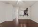 Spacious living room with hardwood floors, ceiling fan, and an open layout to the kitchen at 220 Mount Evans Dr, Durham, NC 27705