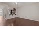 Open-concept living room with hardwood floors and a view of the stylish kitchen at 220 Mount Evans Dr, Durham, NC 27705