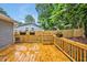 View of a wooden deck featuring flower boxes and a wooden ladder to a fenced yard at 2200 Wyman Pl, Durham, NC 27707