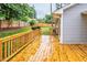 Spacious wood deck featuring a wooden railing with flower boxes for outdoor entertaining at 2200 Wyman Pl, Durham, NC 27707