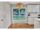 Eat-in kitchen with sliding doors to deck and view of backyard at 2200 Wyman Pl, Durham, NC 27707