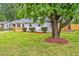 Charming single-story home with a manicured front yard and fresh landscaping at 2200 Wyman Pl, Durham, NC 27707