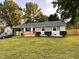 Charming single-story home featuring a welcoming front porch and well-maintained lawn at 2200 Wyman Pl, Durham, NC 27707