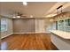 Open-concept living room featuring hardwood floors and stylish lighting fixtures at 2200 Wyman Pl, Durham, NC 27707