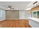 Open-concept living space with wood floors and bar seating open to kitchen at 2200 Wyman Pl, Durham, NC 27707