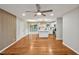 Spacious open-concept living room with wood floors and open to kitchen and sliding doors to deck at 2200 Wyman Pl, Durham, NC 27707