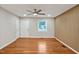 Inviting living room with wood accent wall and wood floors at 2200 Wyman Pl, Durham, NC 27707